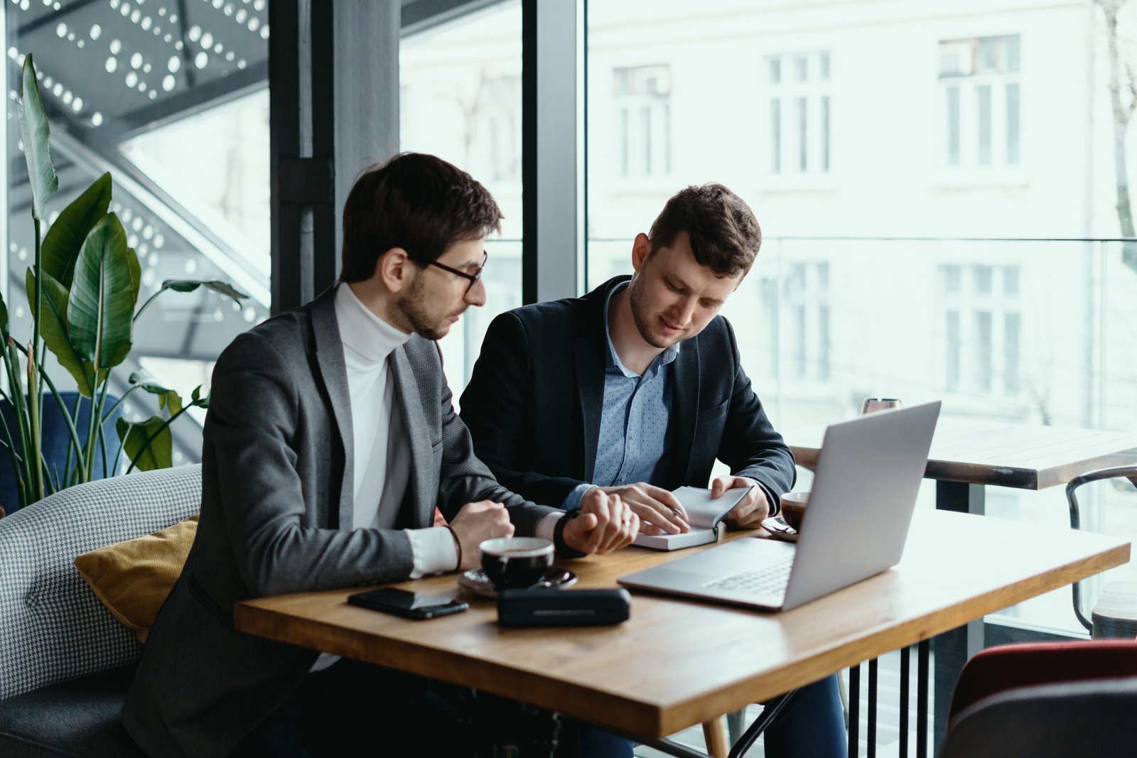 Restaurant owners reviewing financial reports with their bookkeeper